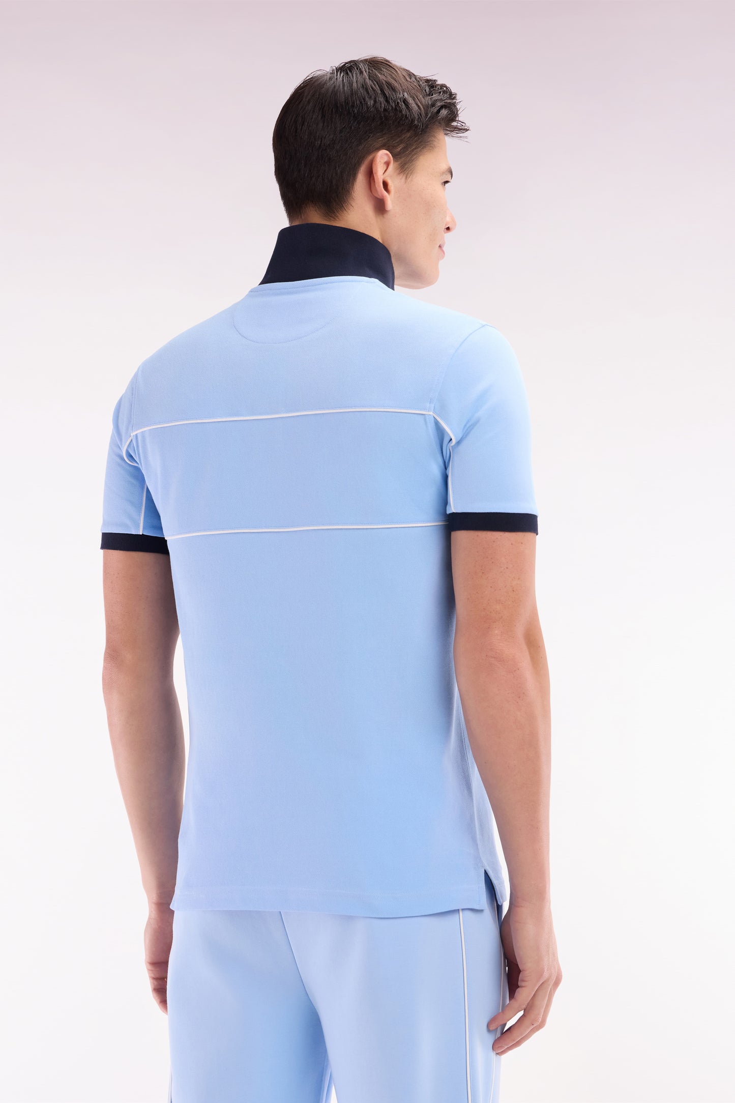 Straight-fit short-sleeved polo shirt in sky blue cotton piqué with piped cut-outs