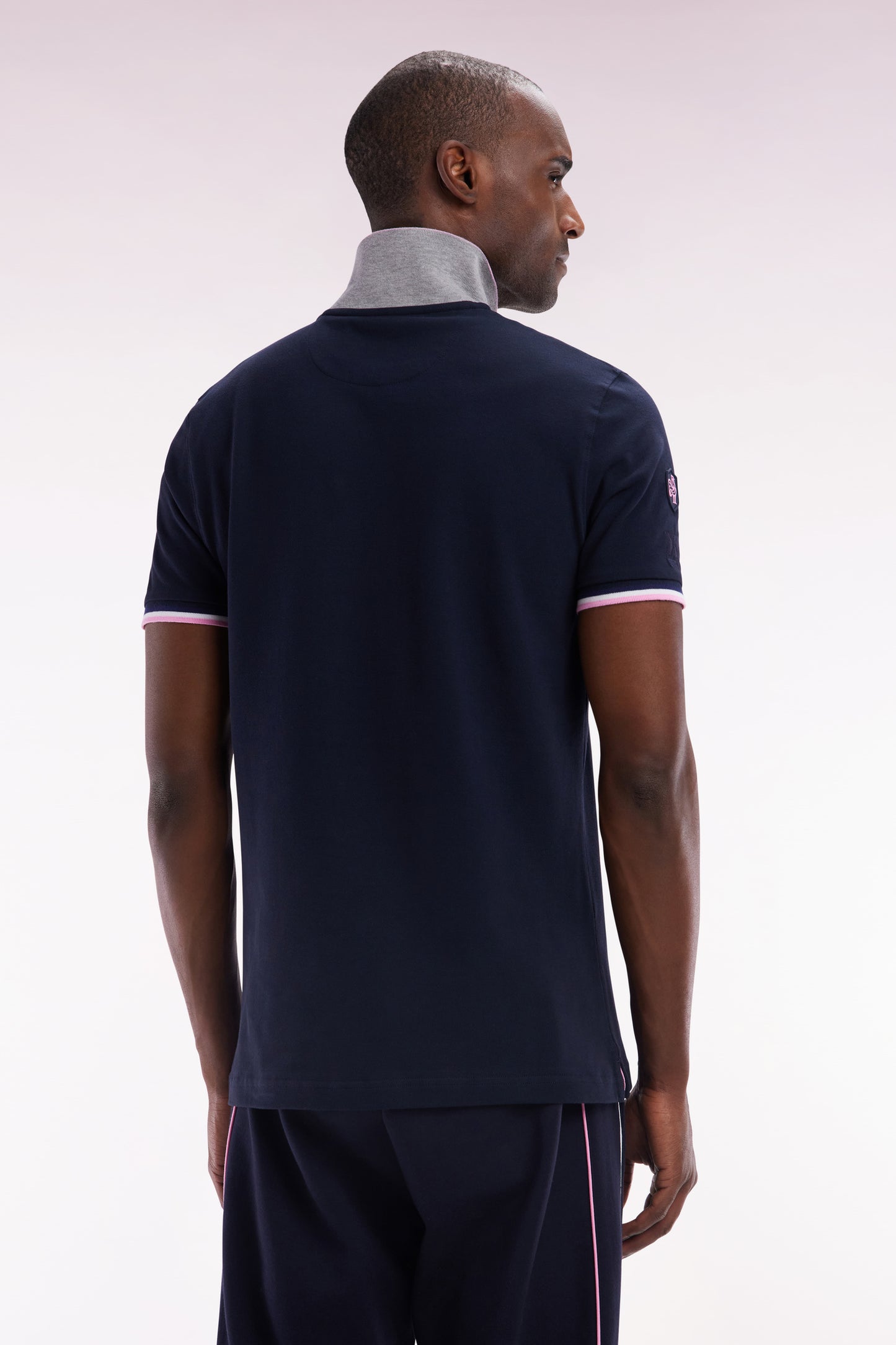 Slim-fit short-sleeved polo shirt in navy stretch cotton with zipped collar