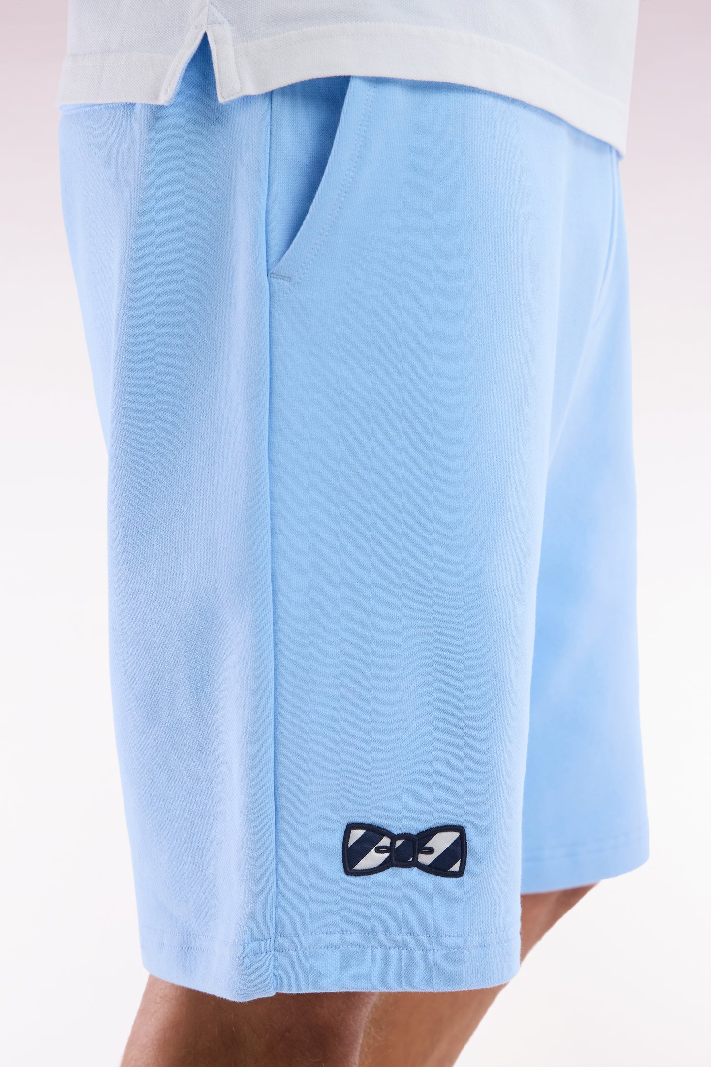 Relaxed-fit sky blue cotton fleece shorts with a striped bow tie embroidery