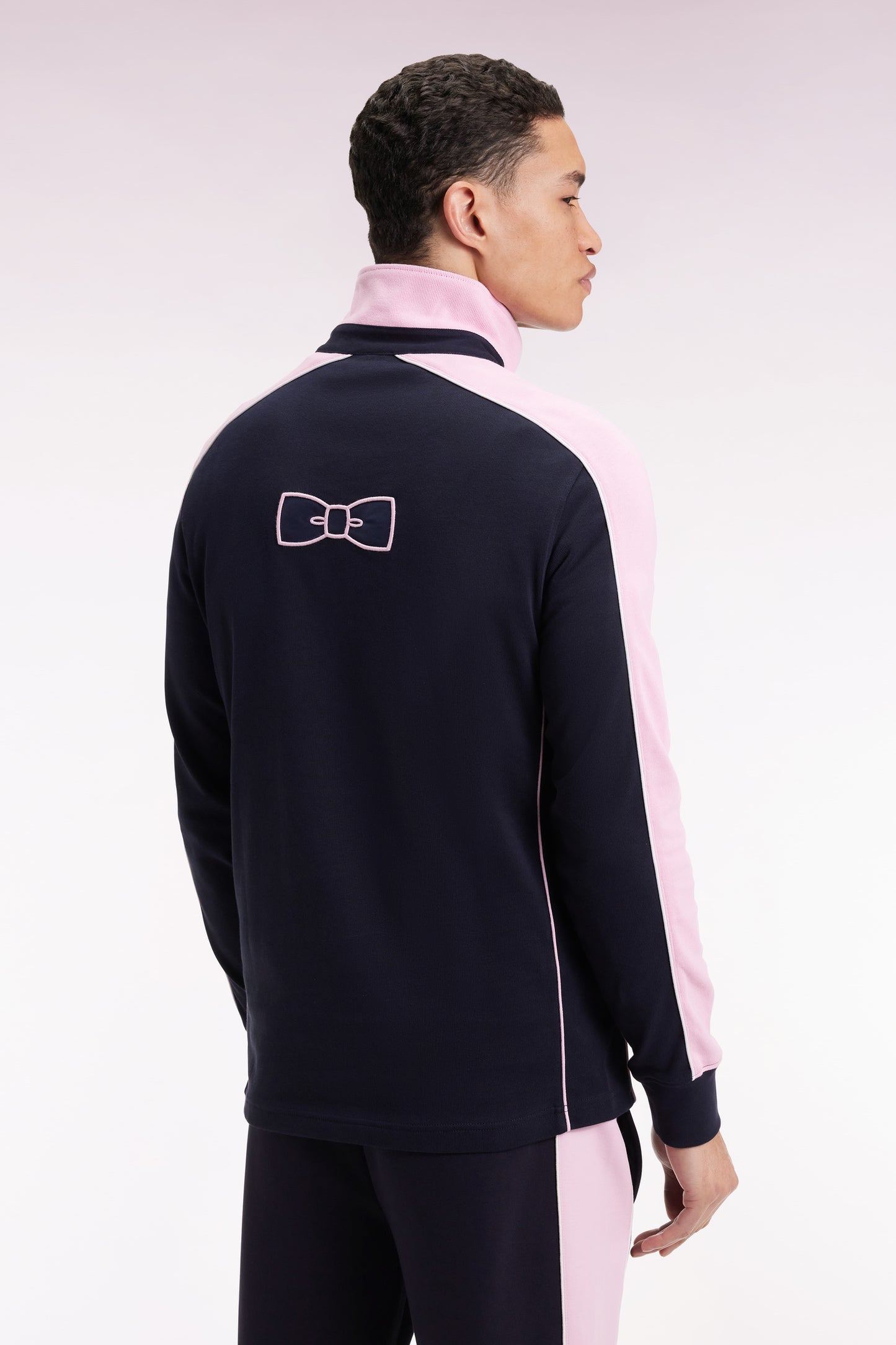 Navy and pink long-sleeved jersey with bow-tie embroidery, straight cut