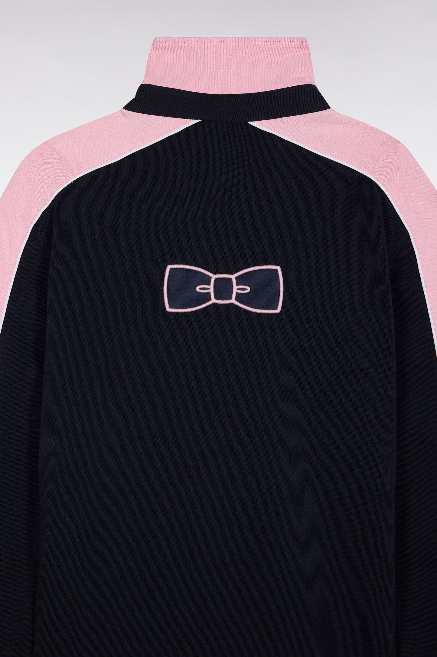 Navy and pink long-sleeved jersey with bow-tie embroidery, straight cut