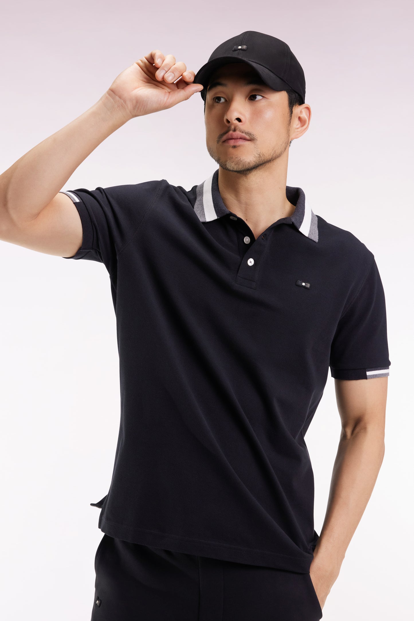 Short-sleeved polo shirt in black cotton with tricolored details, loose fit