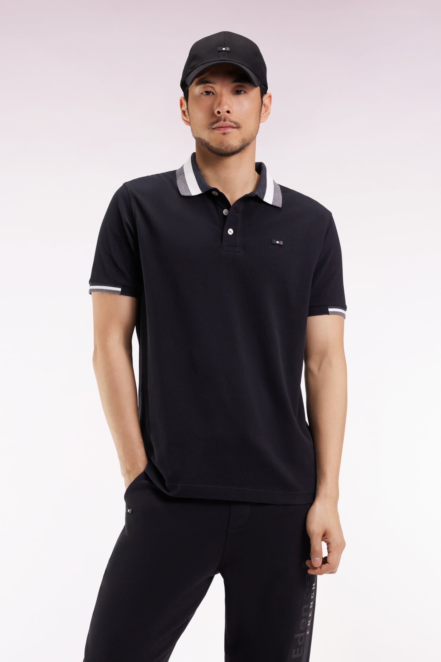 Short-sleeved polo shirt in black cotton with tricolored details, loose fit