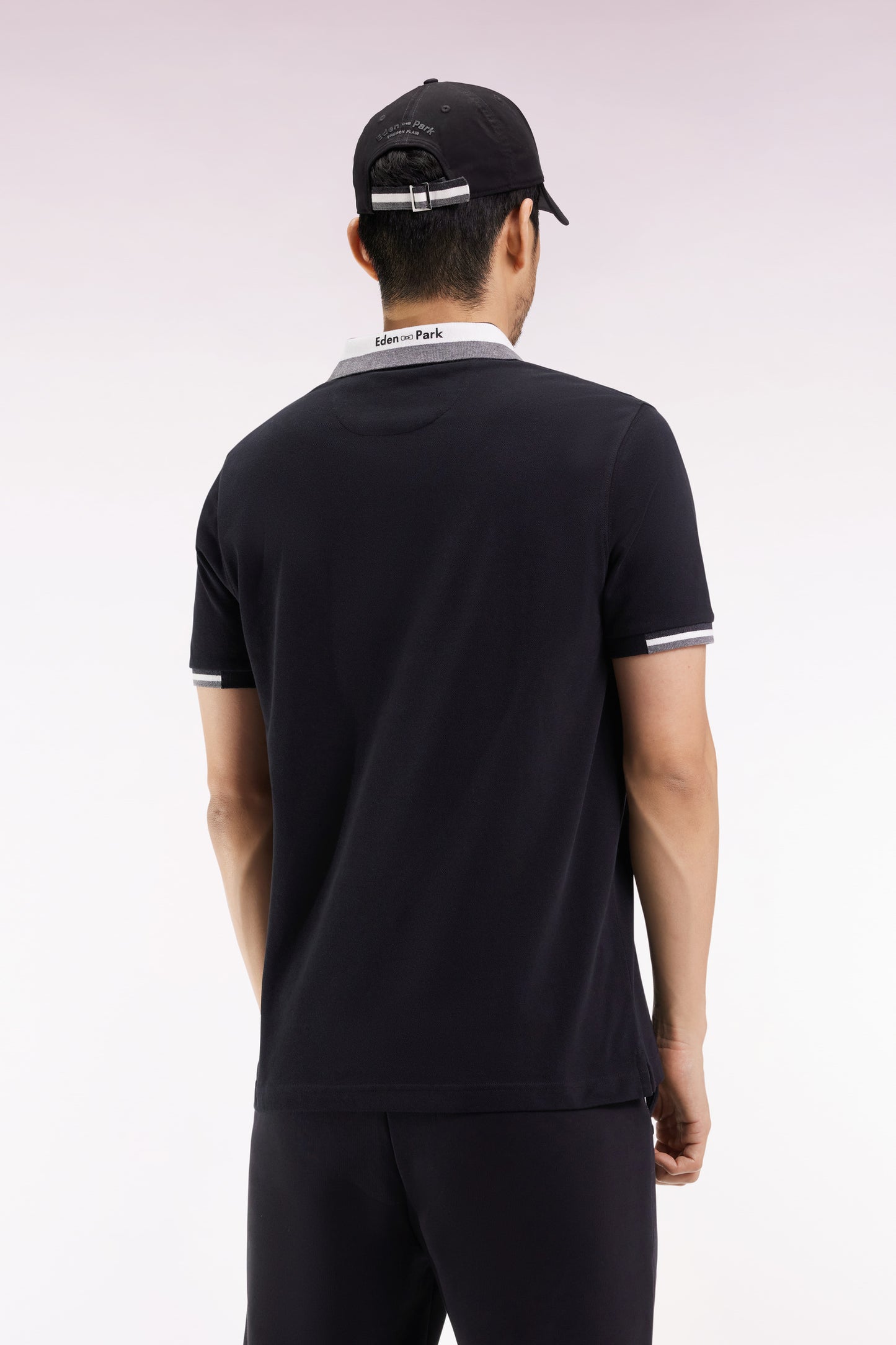 Short-sleeved polo shirt in black cotton with tricolored details, loose fit
