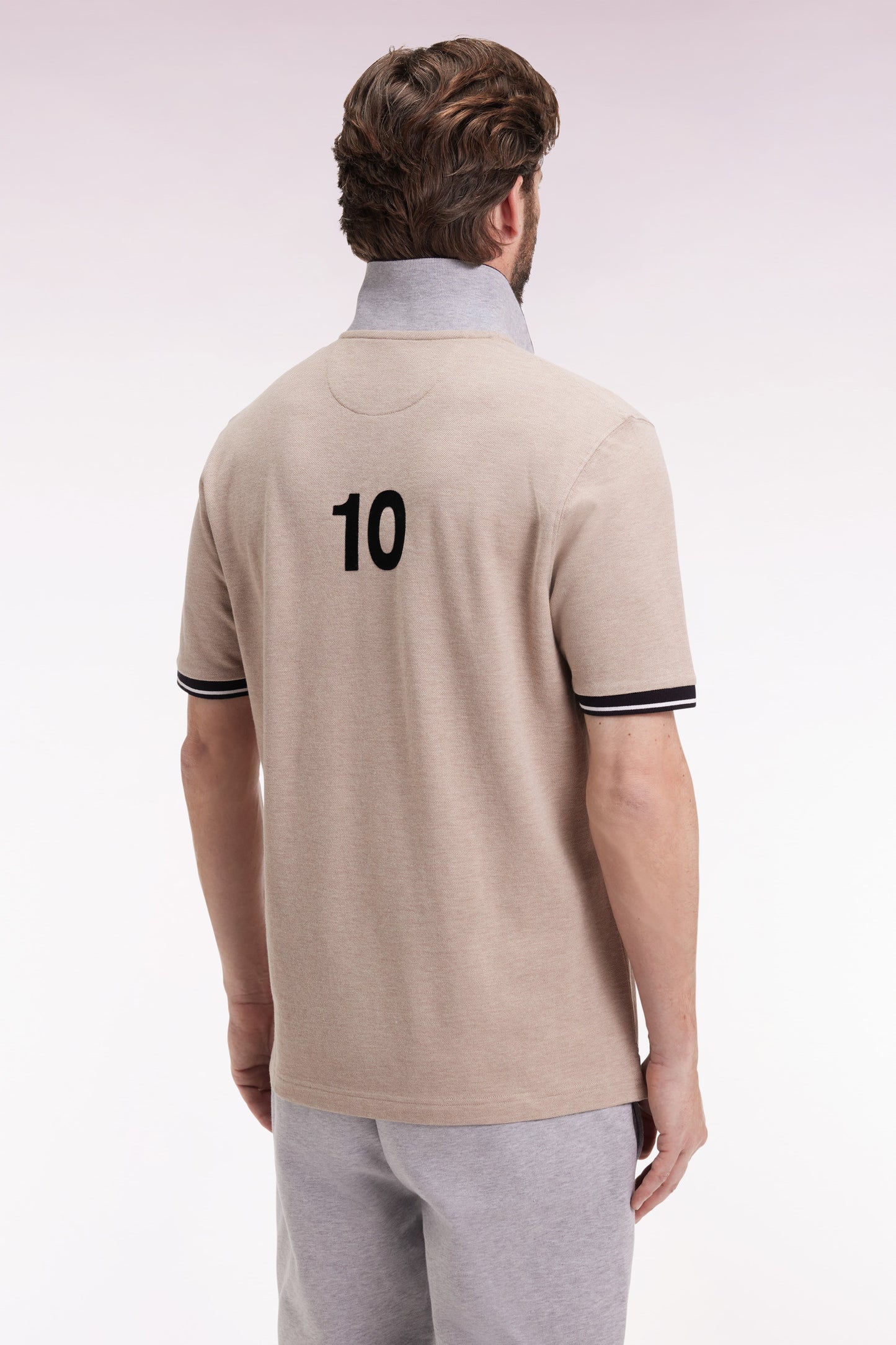New Zealand short-sleeved polo shirt in beige cotton piqué, loose fit