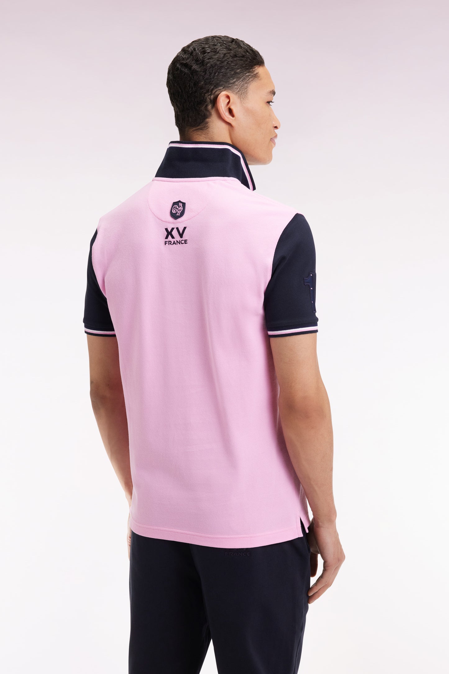 Short-sleeved pink and navy polo shirt with tricolored trim, straight cut