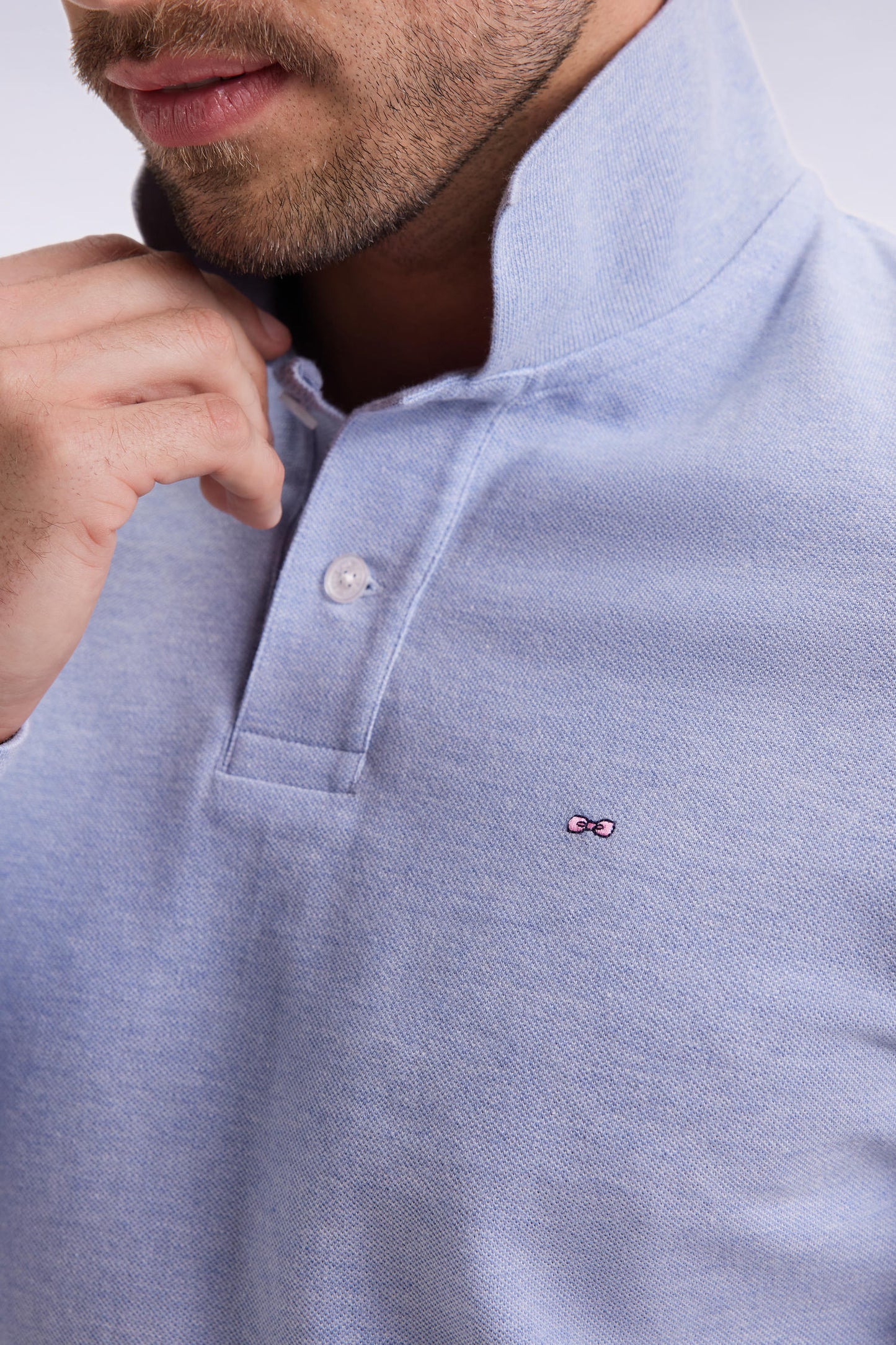 Long-sleeved polo shirt in sky-blue mottled cotton, straight cut