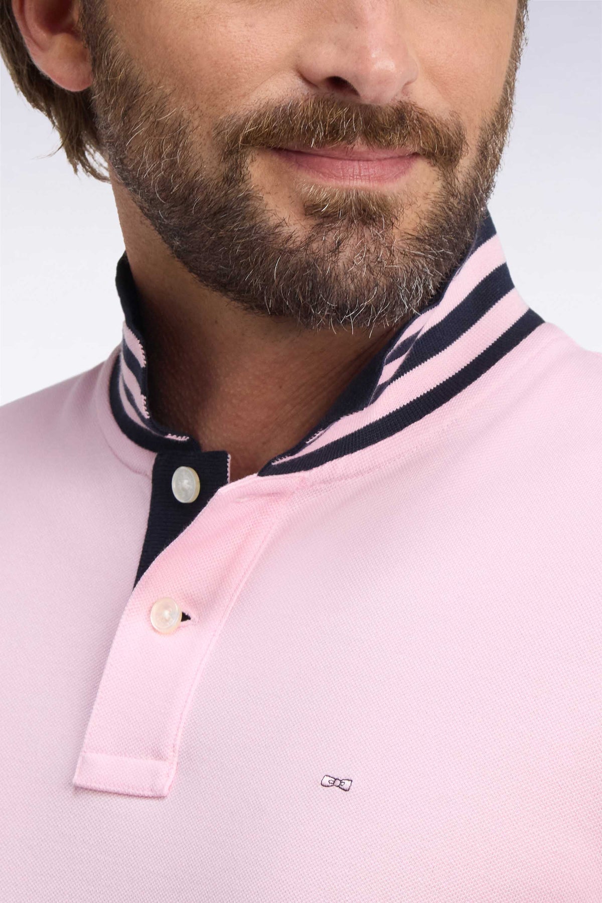 Polo manches courtes sous-col rayé en coton Pima rose coupe droite