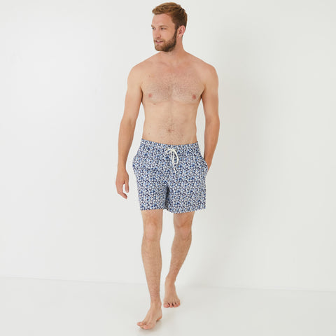 Blue swim shorts with floral pattern - Image 1