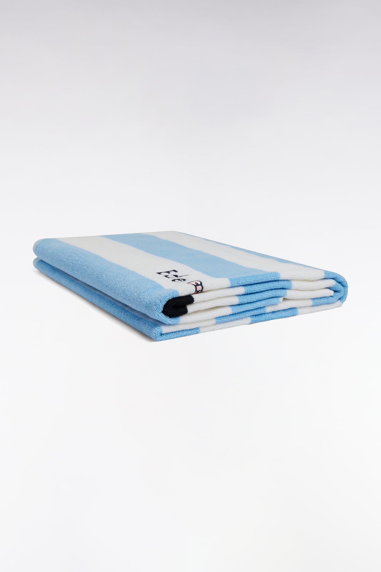 Striped beach towel in sky blue terry cotton