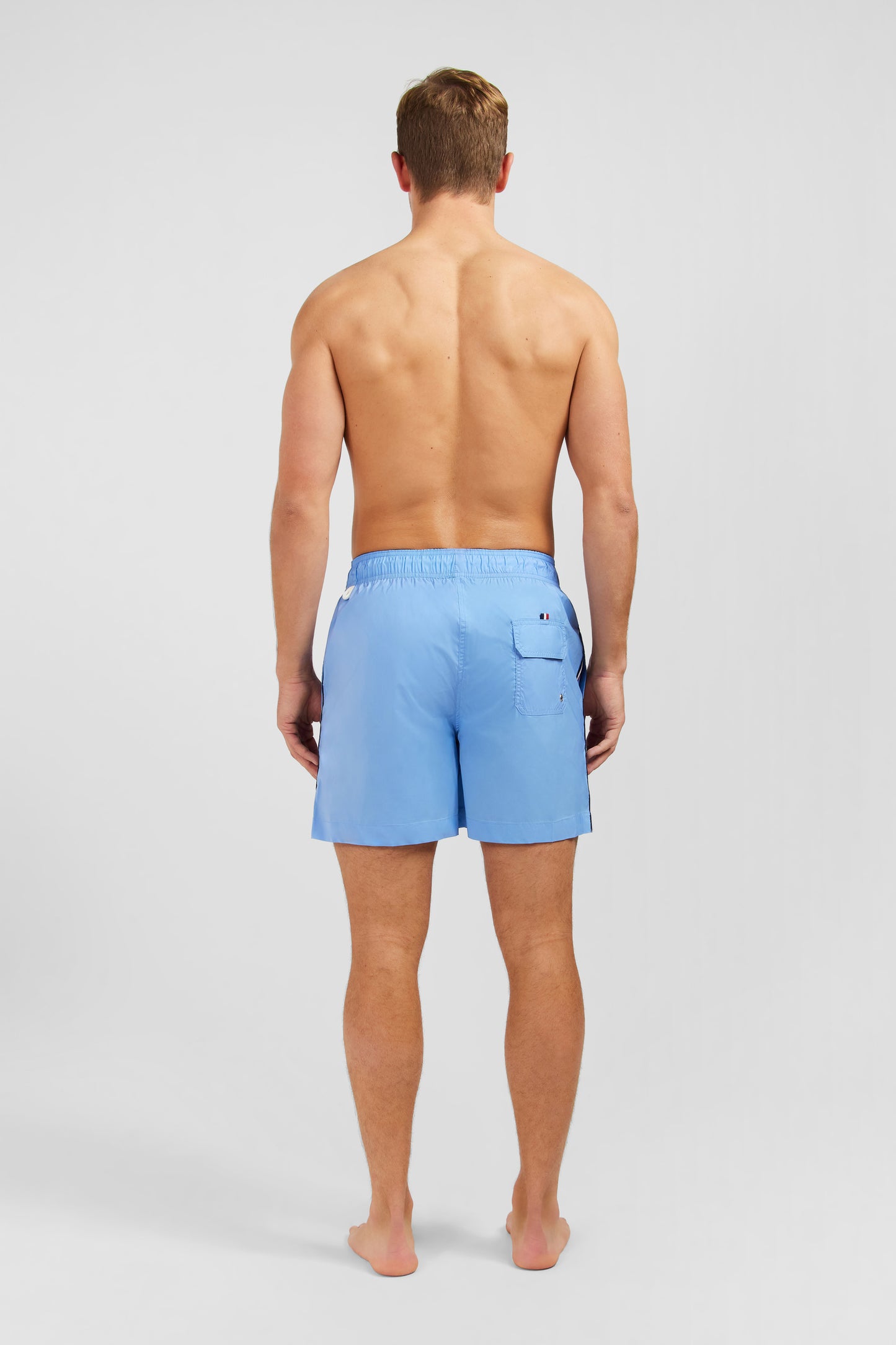 Short de bain uni détail bandes tricolores