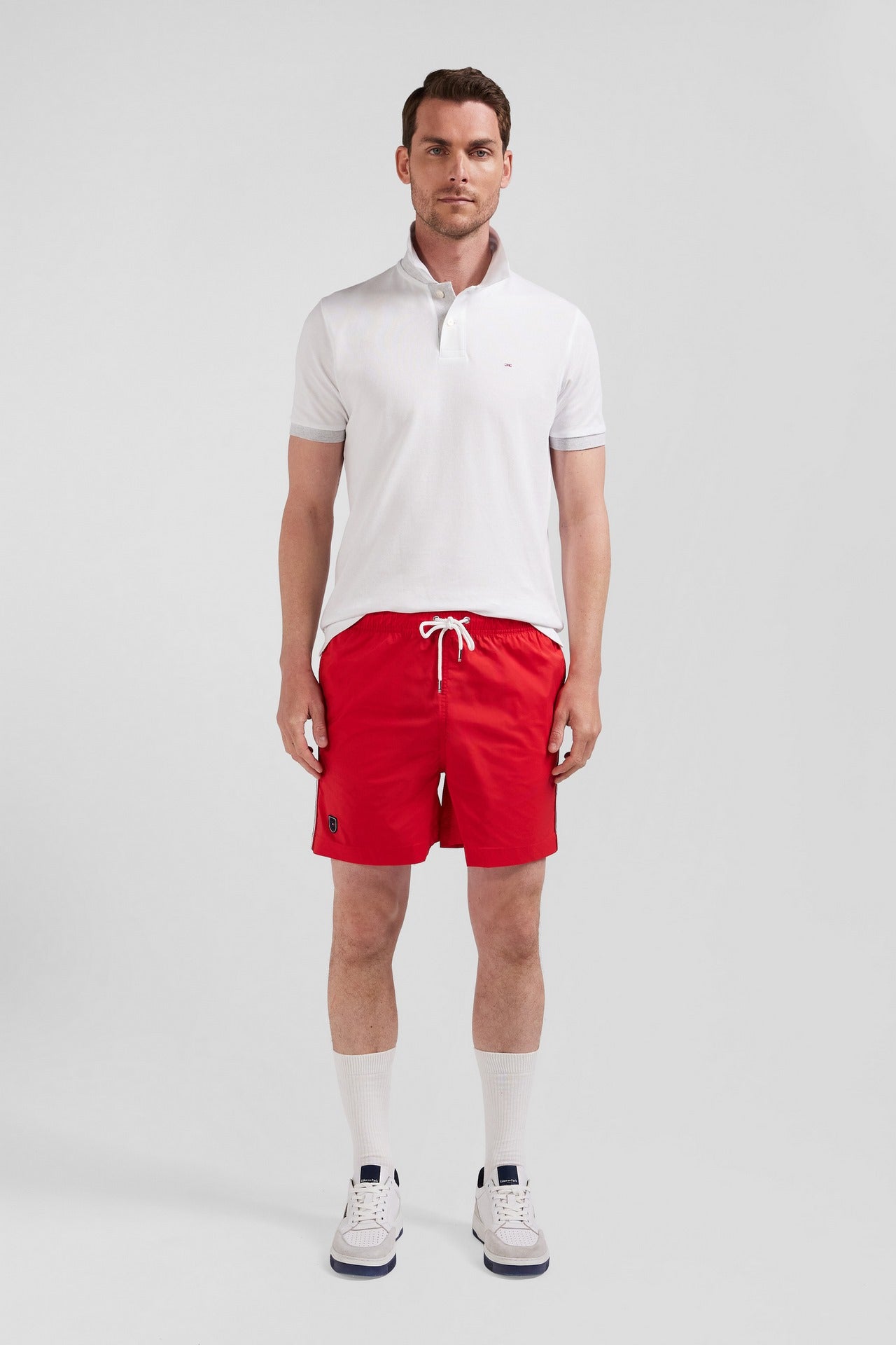 Short de bain uni détail bandes tricolores