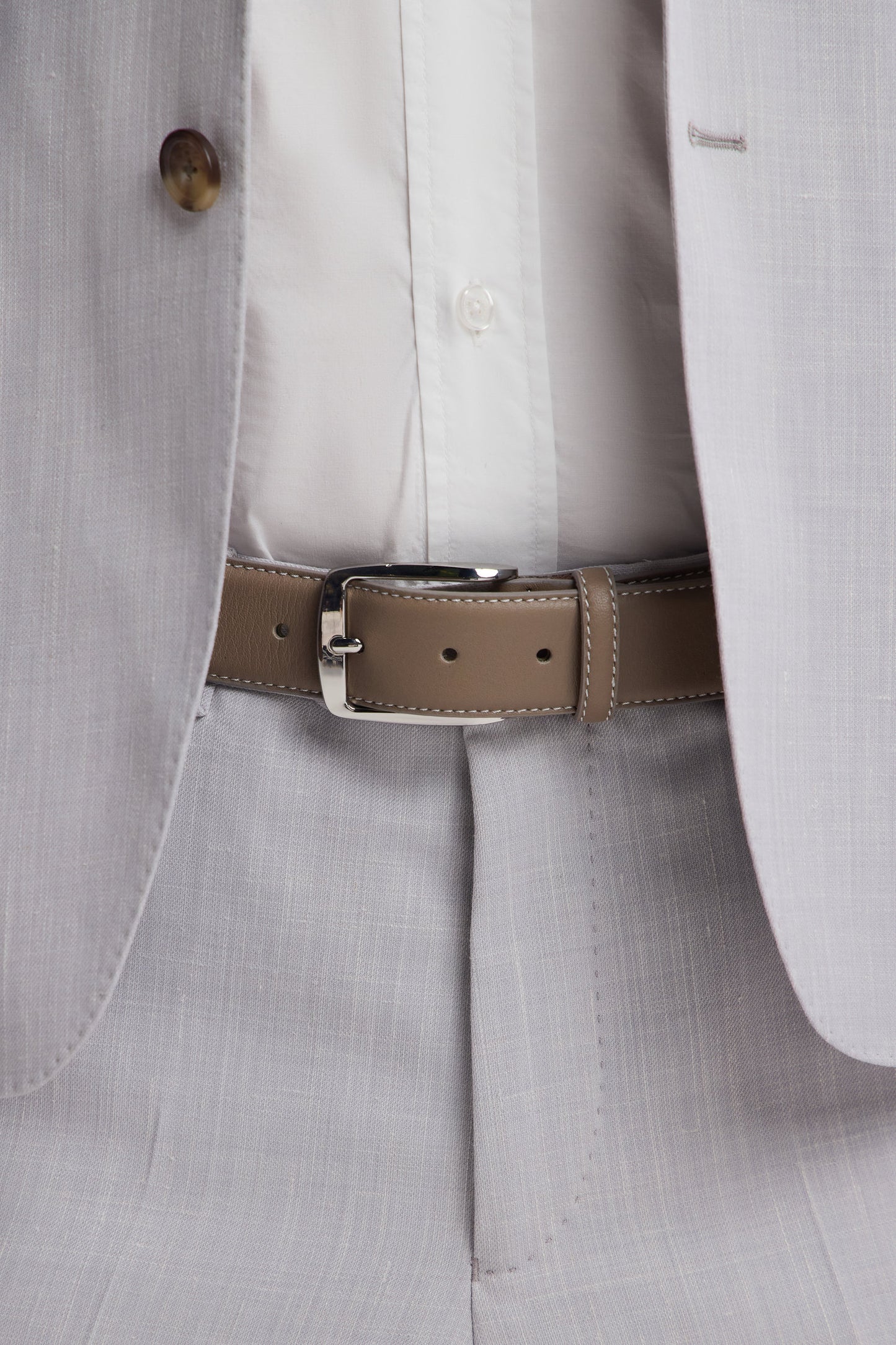 Beige smooth leather belt with white stitching