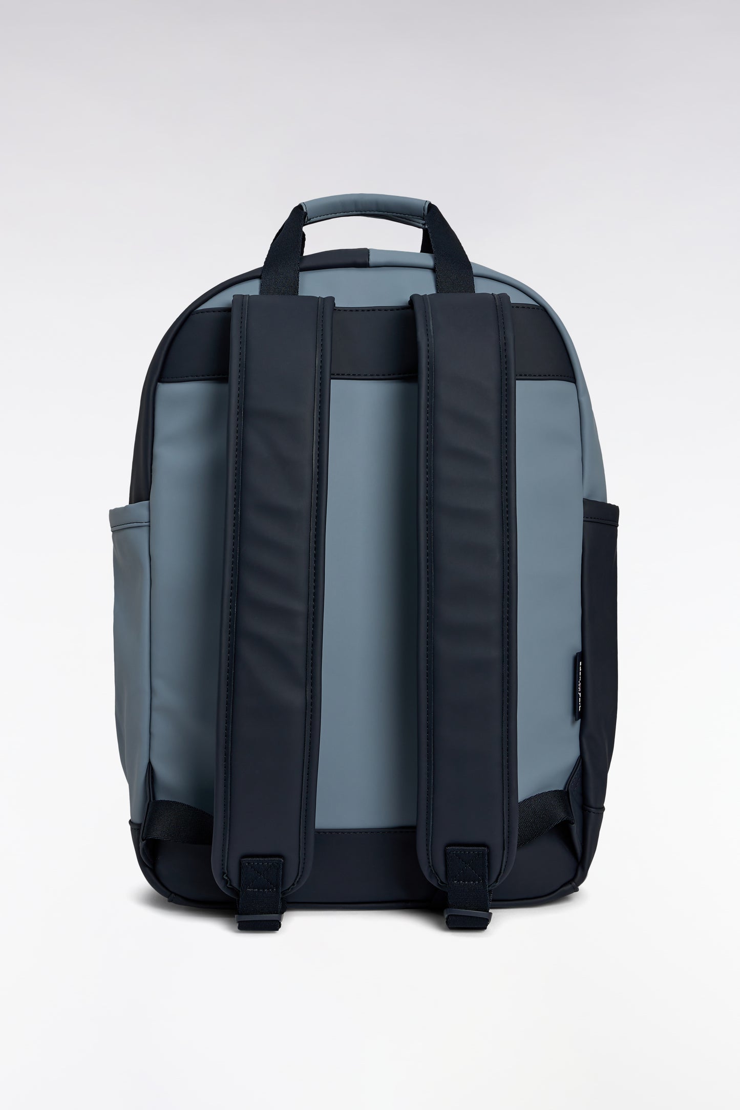 Cut and sew colorblock backpack in navy and grey rubber