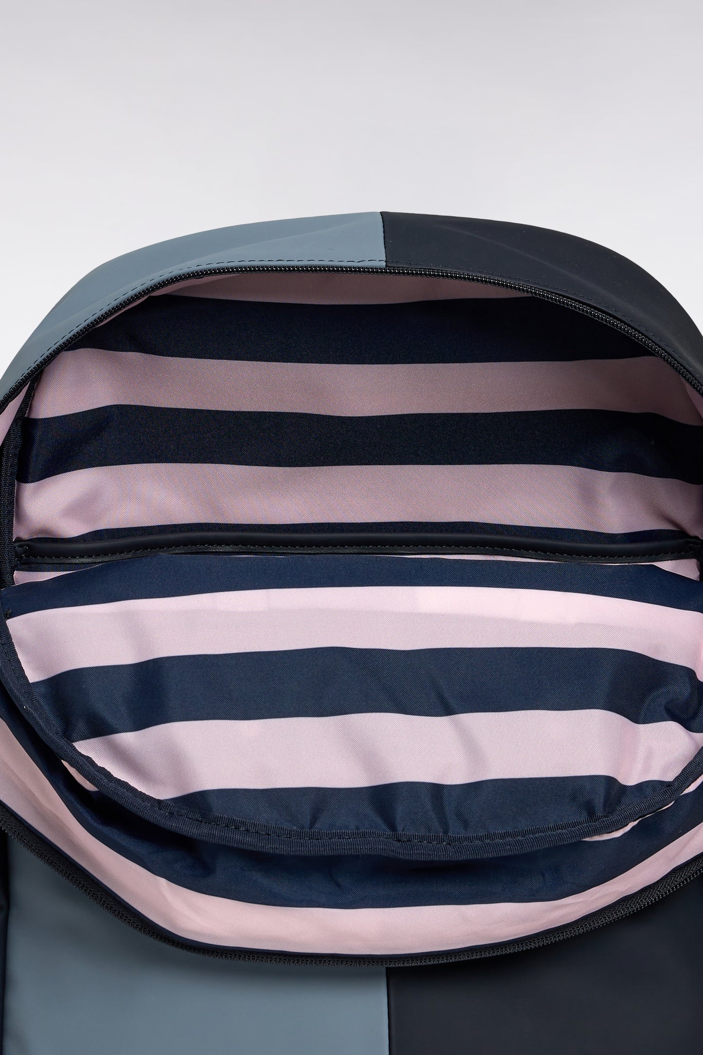 Cut and sew colorblock backpack in navy and grey rubber
