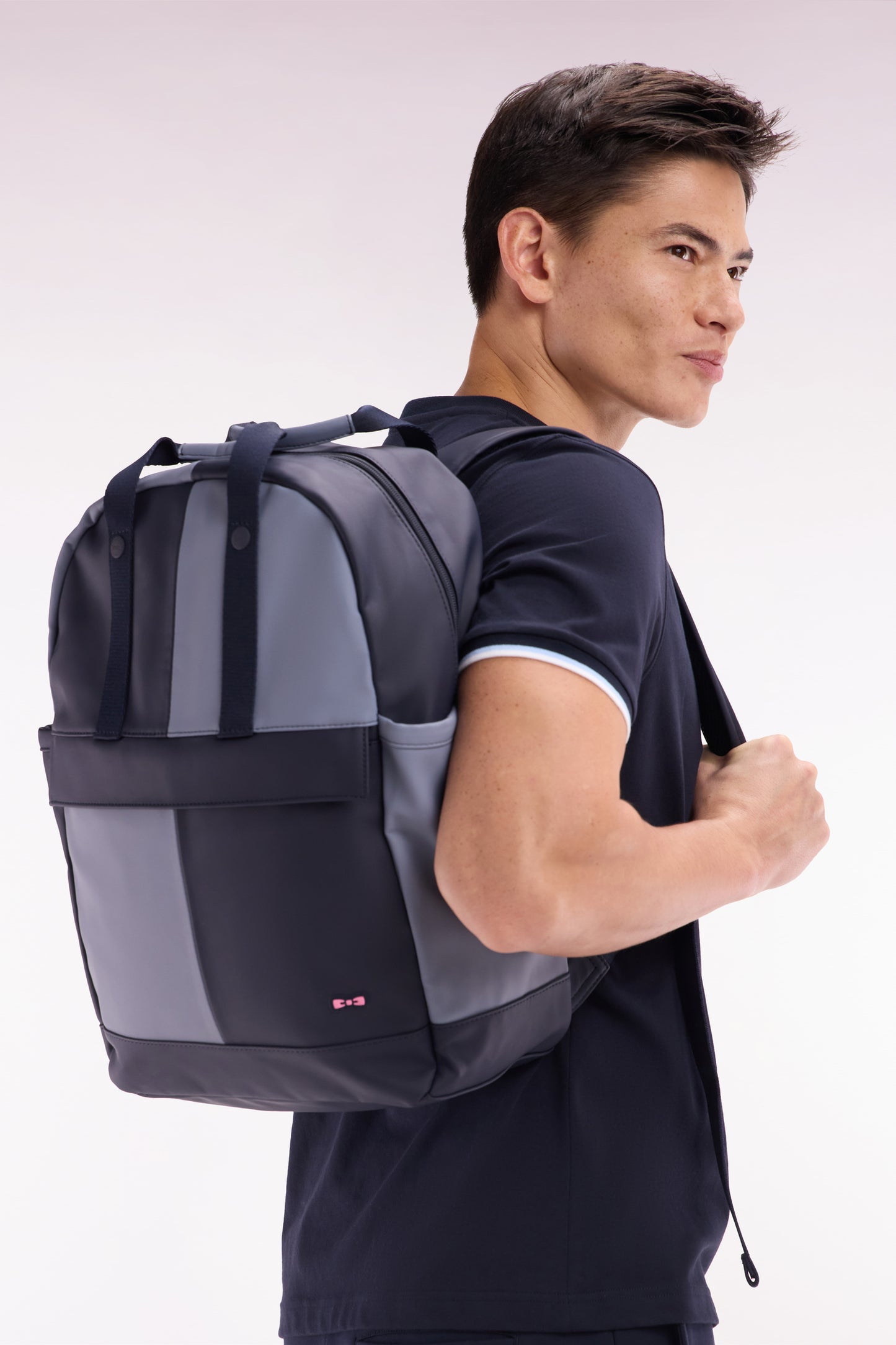 Cut and sew colorblock backpack in navy and grey rubber