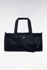 Navy and black duffle bag in leather and fabric