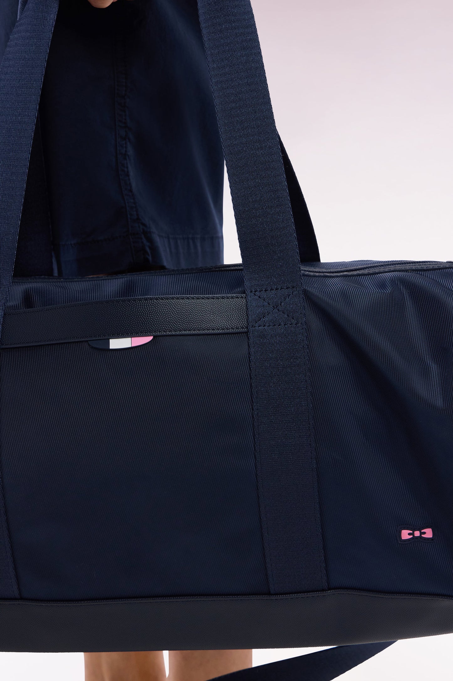 Navy and black duffle bag in leather and fabric
