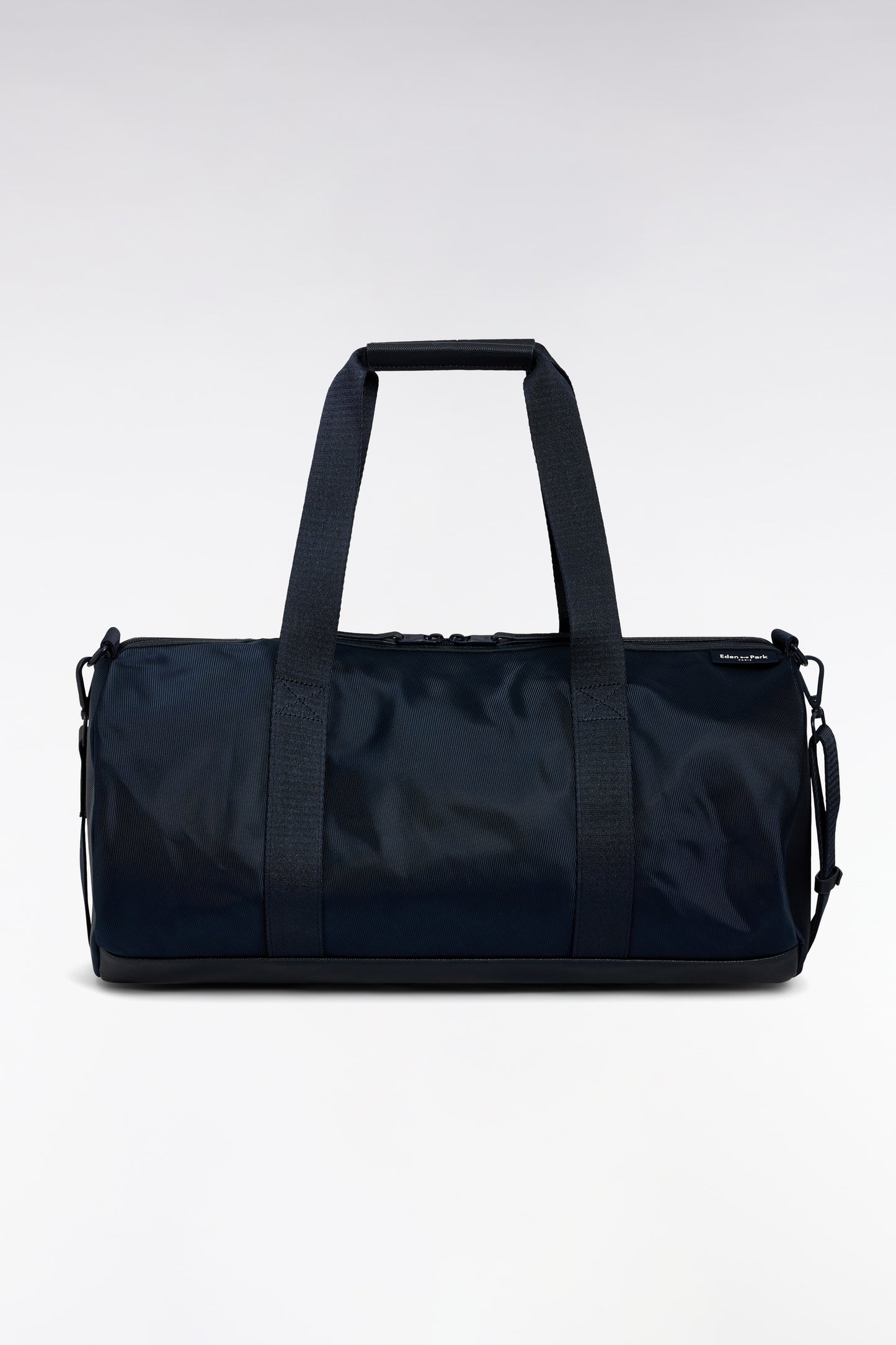 Navy and black duffle bag in leather and fabric