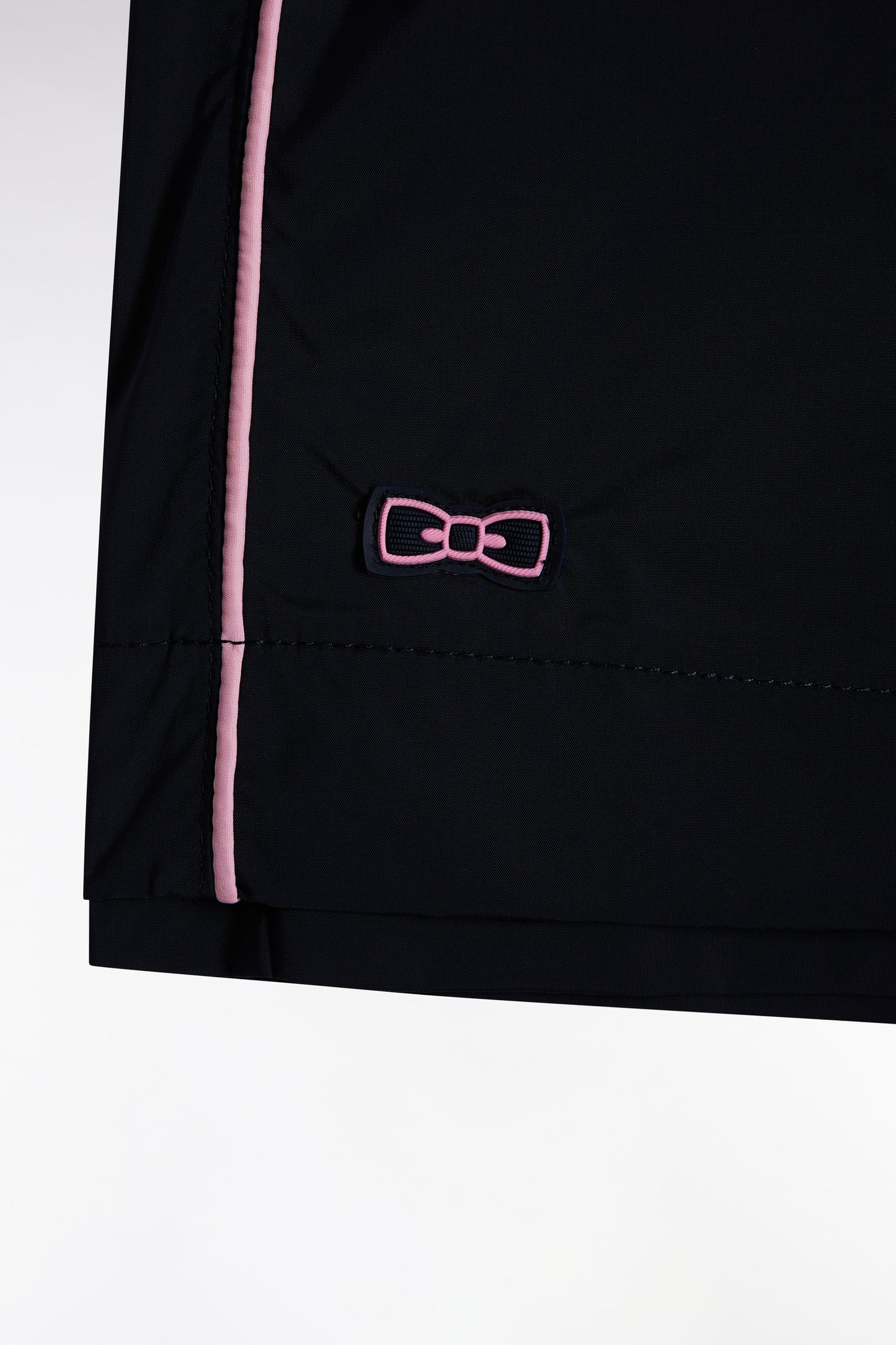 Navy swimsuit with pink piping