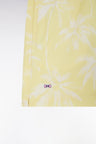 Yellow children's swimsuit with palm tree print