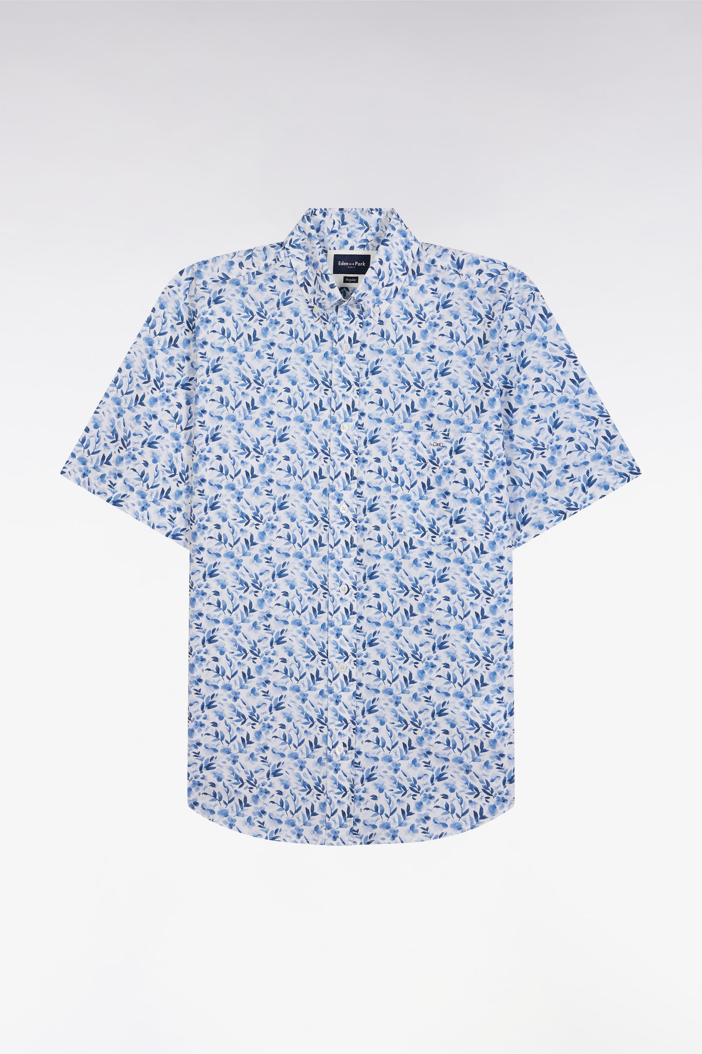 Straight short-sleeved blue shirt in cotton poplin with vegetal print