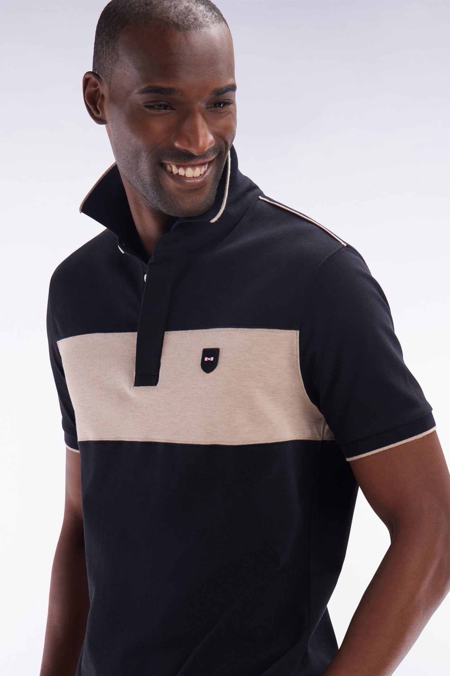 Slim-fit short-sleeved polo shirt in black stretch cotton with contrasted stripe