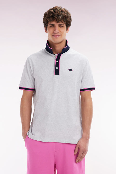 Relaxed-fit short-sleeved polo shirt in pink cotton with colorful stripes - Image 1