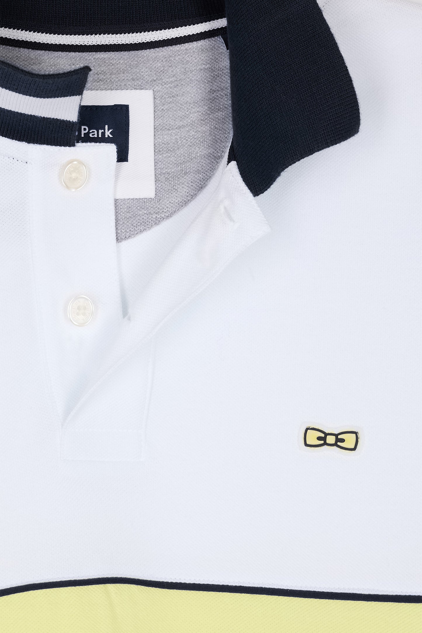 Relaxed-fit two-tone short-sleeved polo shirt in yellow and white cotton