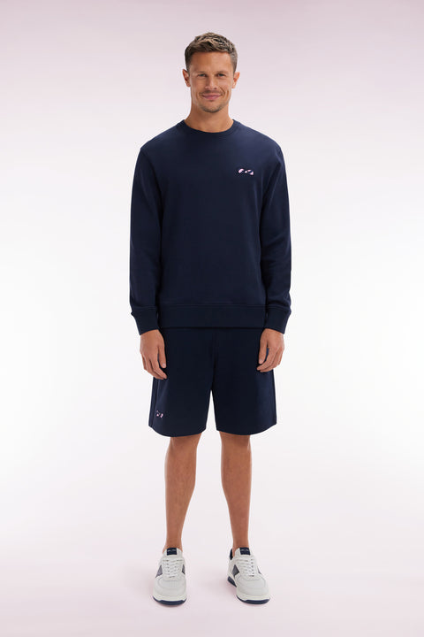 Relaxed-fit navy cotton fleece shorts with a striped bow tie embroidery - Image 1
