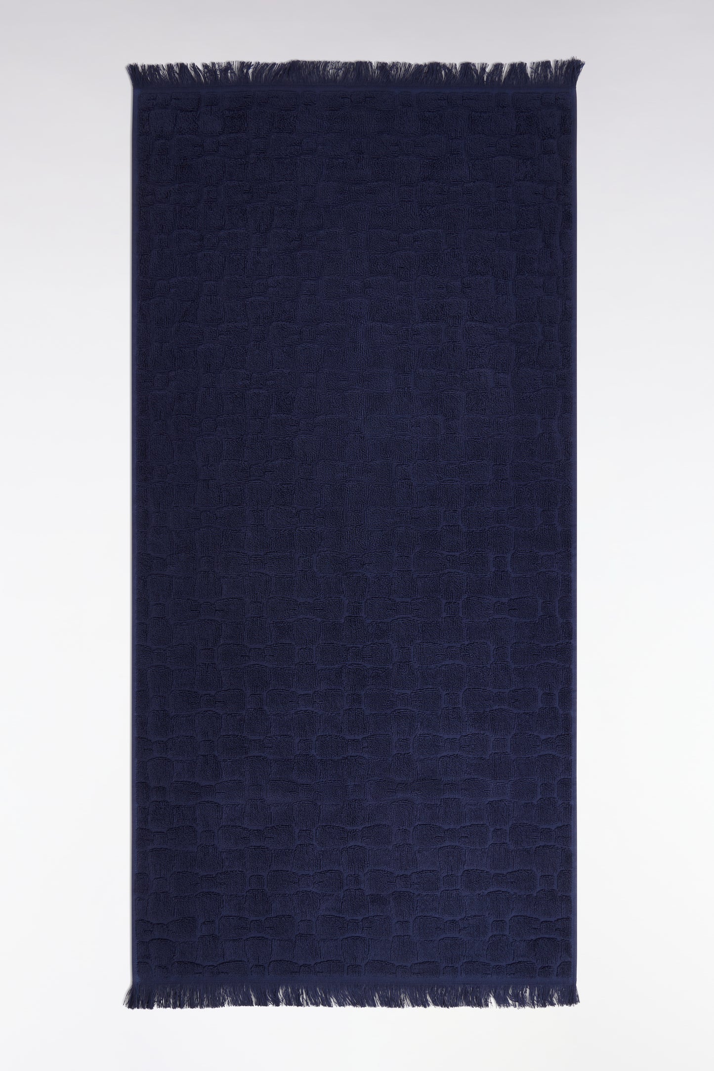 Navy cotton hand towel with bow tie micro-patterns