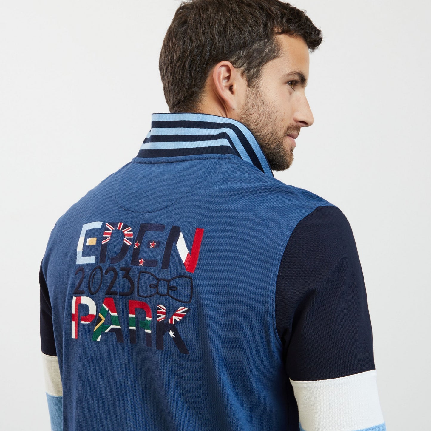 Blue colourblock polo shirt with 2023 embroidery
