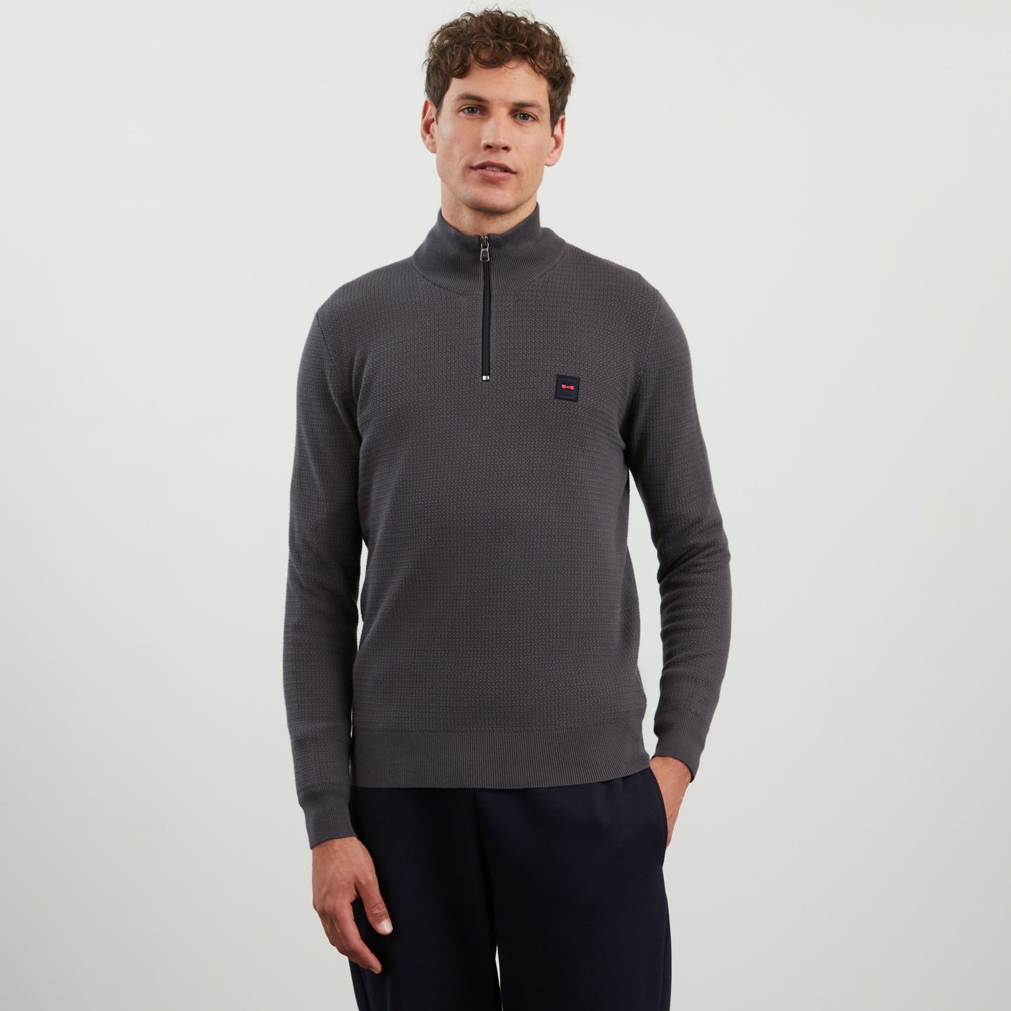 Dark grey zip-neck jumper in decorative cable knit