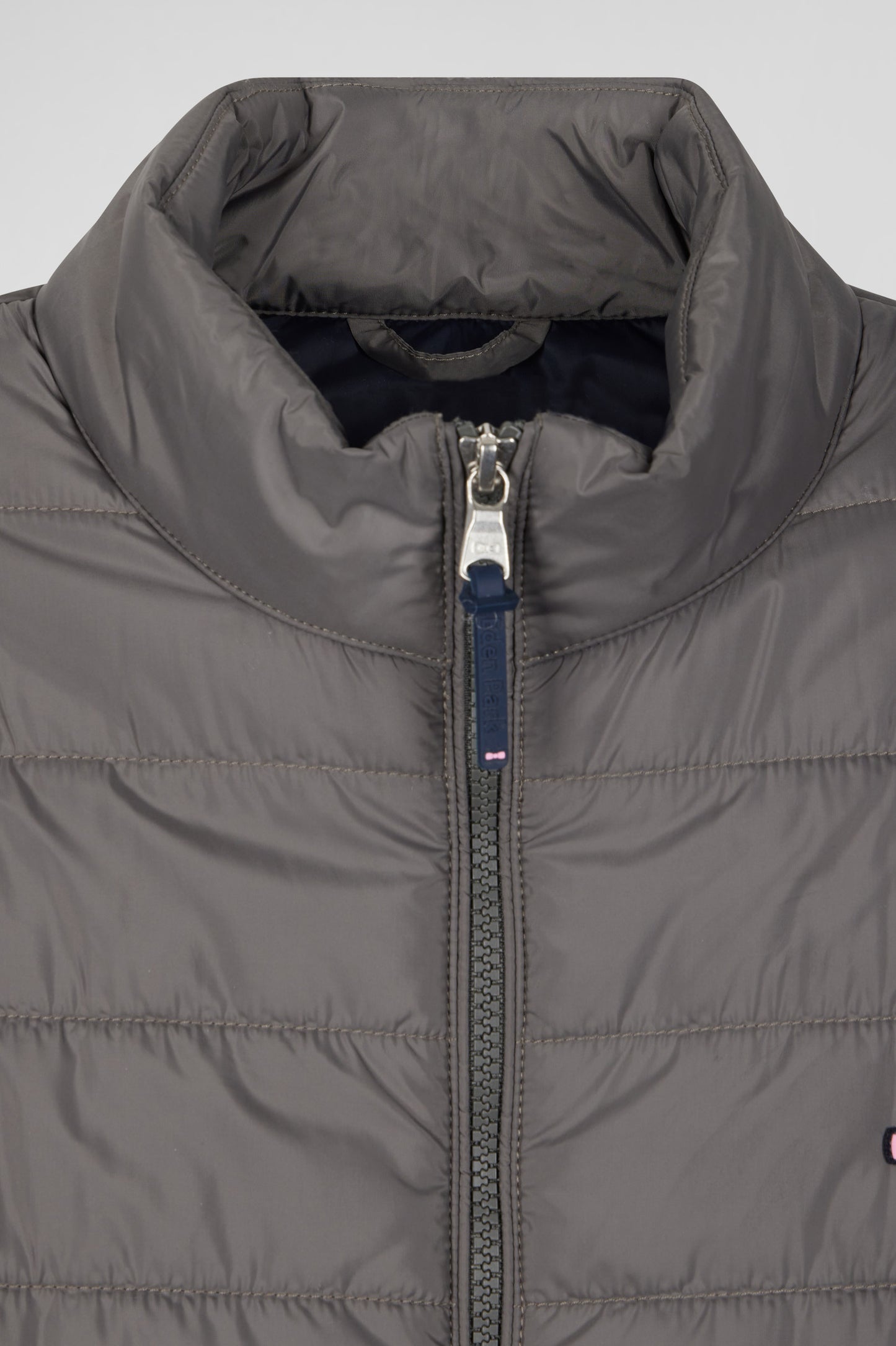 Grey quilted sleeveless high collar down vest