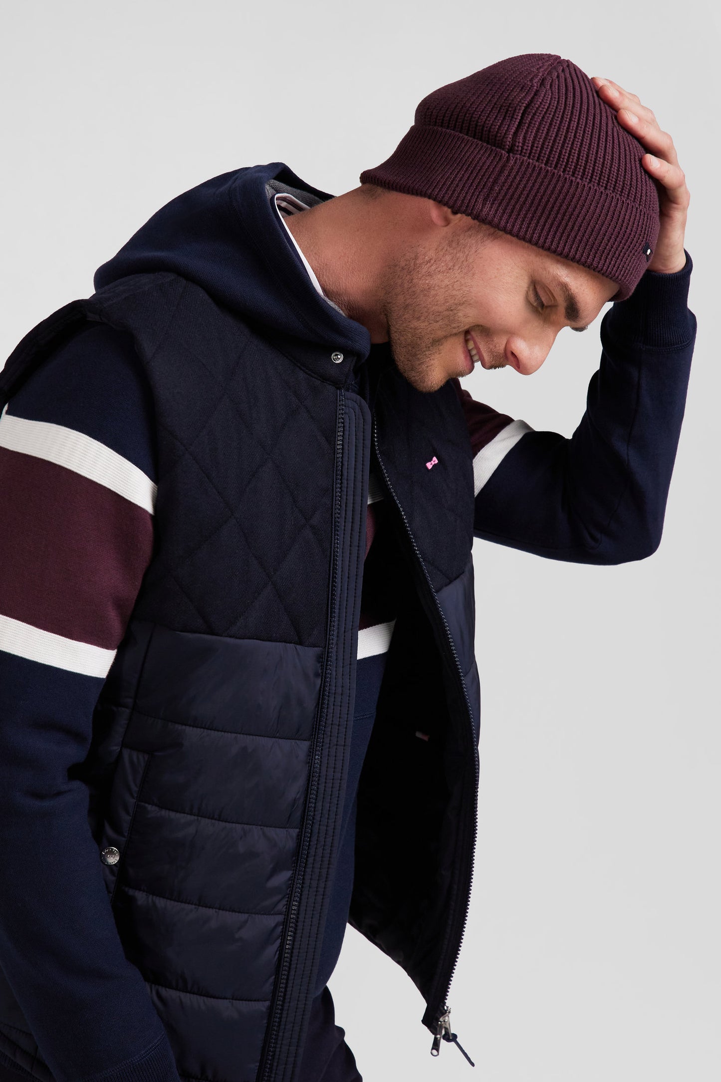 Navy blue sleeveless double quilted high collar down vest