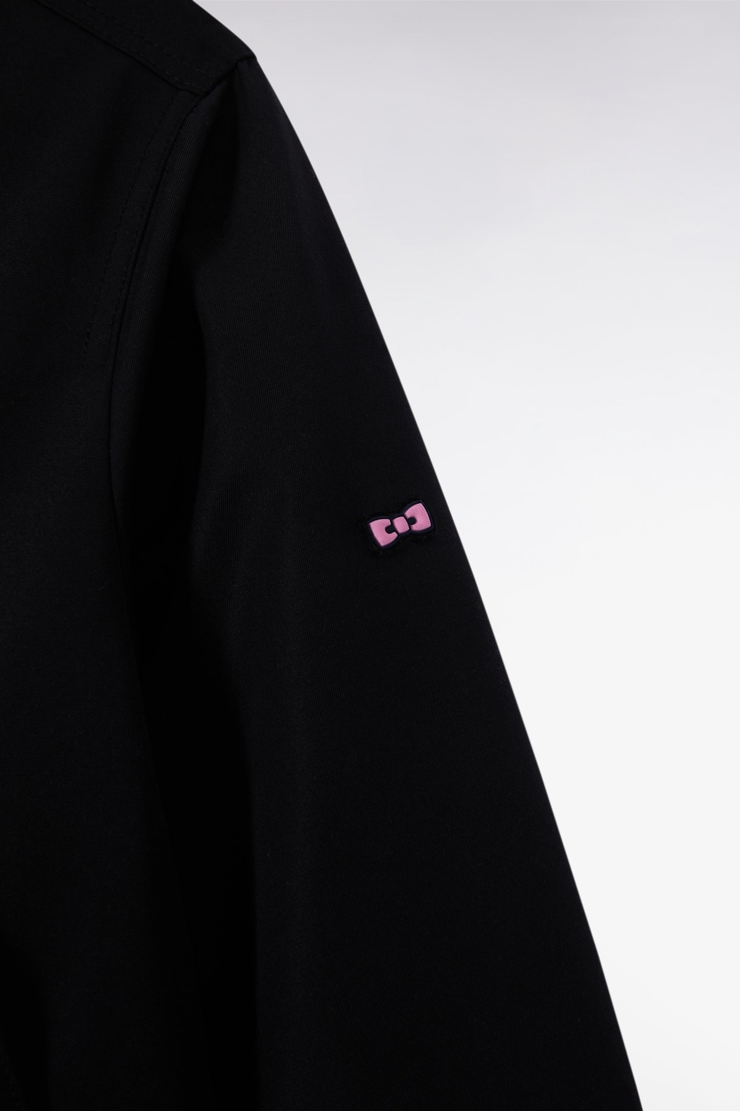 Parka courte en nylon noir à poches plaquées