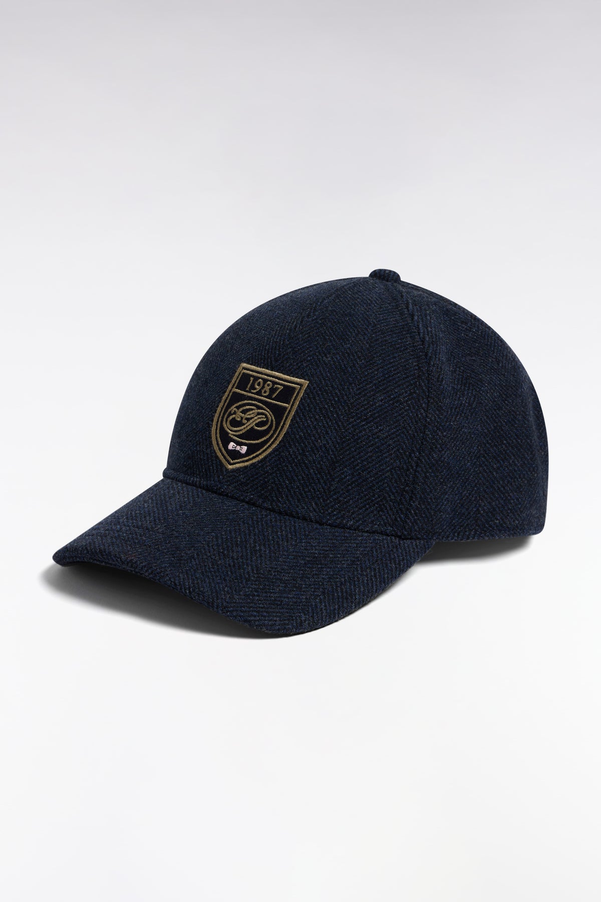 Gray herringbone wool cloth cap with crest patch