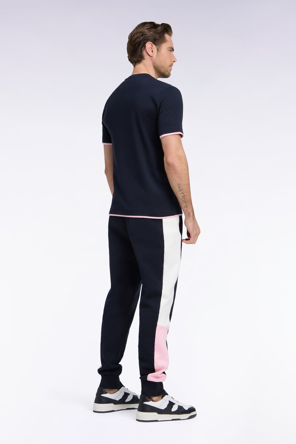 Navy fleece joggers with contrasting leg cutouts, straight cut