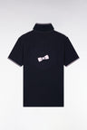 Polo manches courtes en piqué coton blanc et marine dos brodé coupe droite