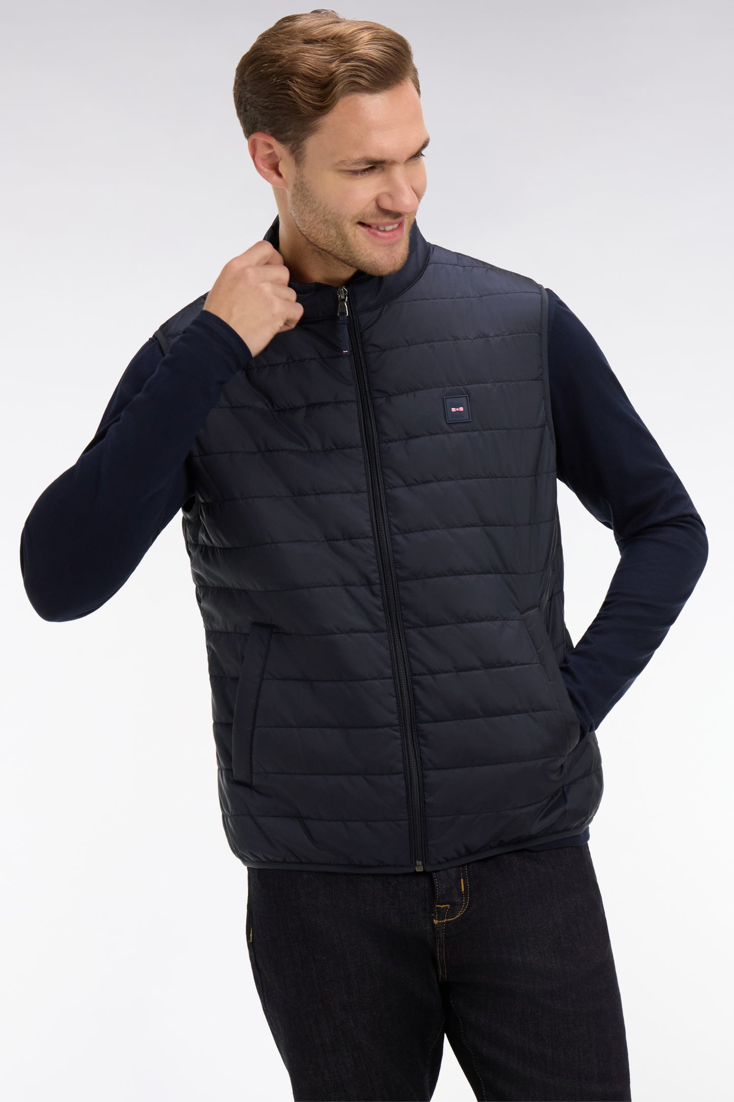 Navy blue sleeveless puffa jacket