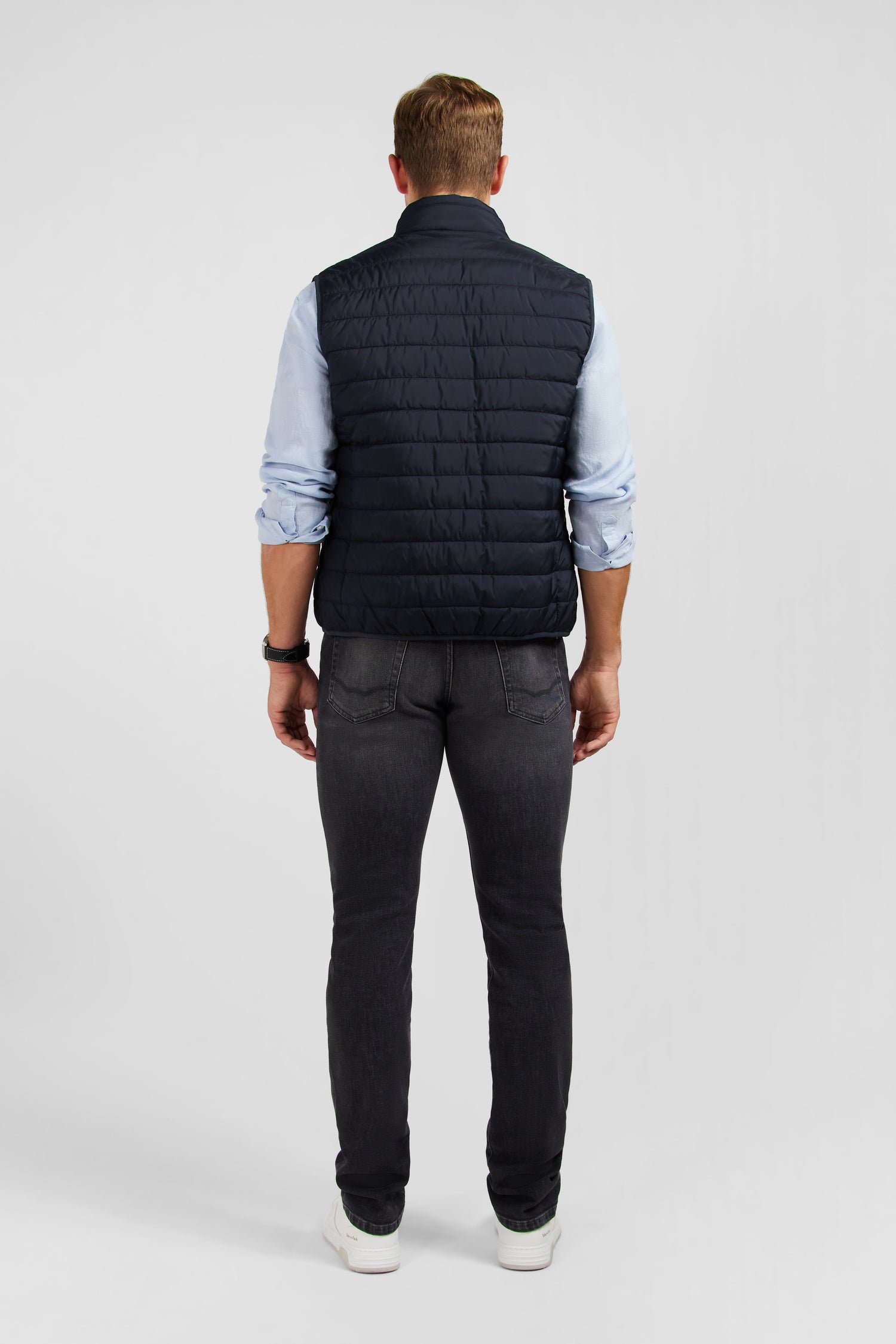 Navy blue sleeveless puffa jacket