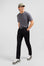 Slim black wool trousers with broken fold