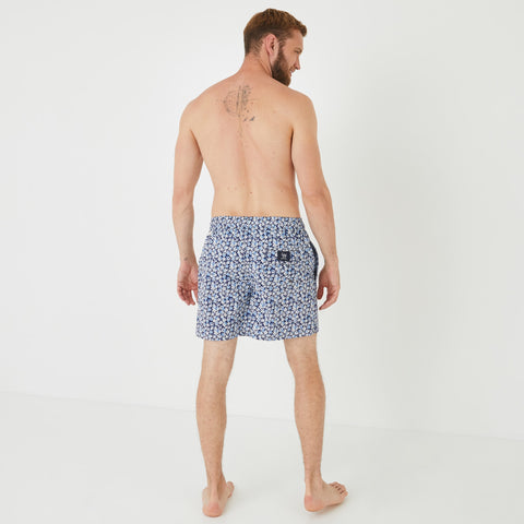 Blue swim shorts with floral pattern - Image 3