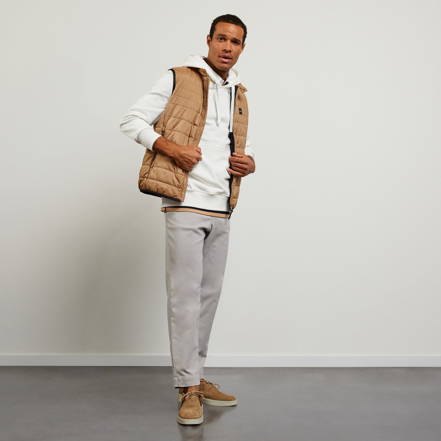 Beige sleeveless puffa jacket
