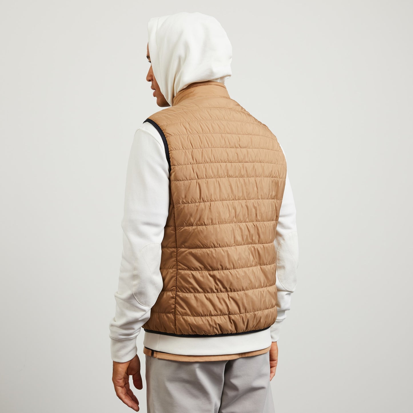 Beige sleeveless puffa jacket