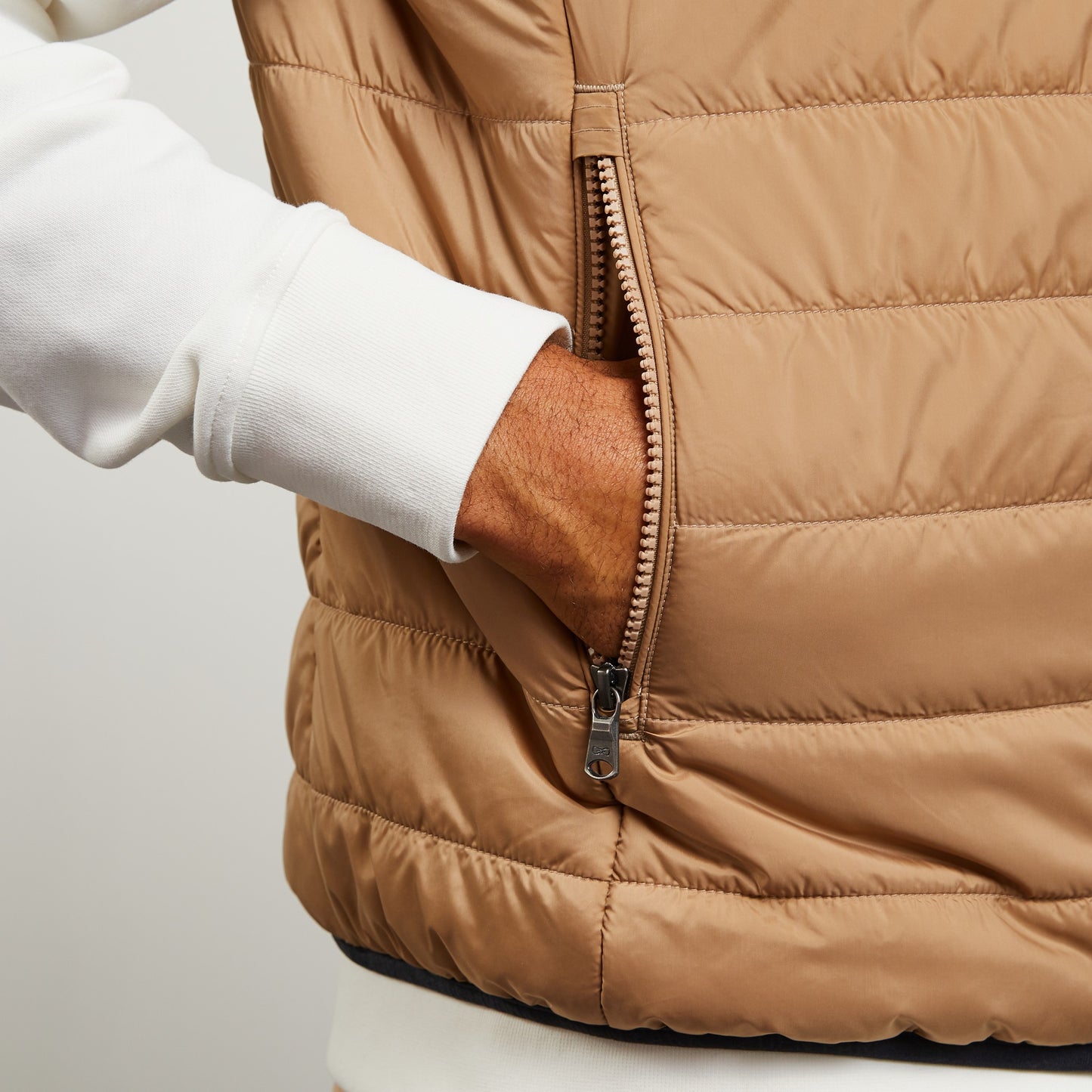 Beige sleeveless puffa jacket